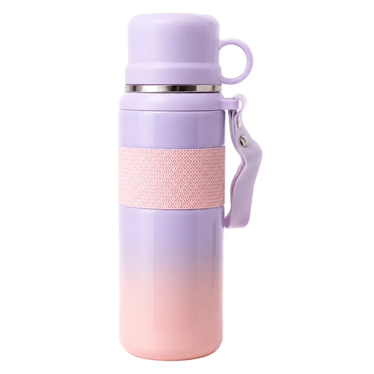 Lavender to pink gradient travel mug with textured grip and handle, ideal for on-the-go hydration.